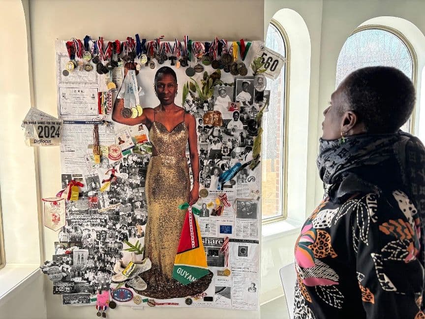 photo of a Black person facing a collage board if themselves as a central figure surrounded by clips of their achievements.